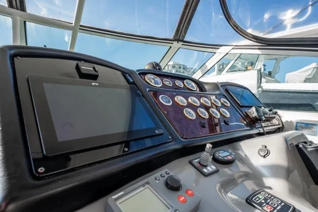 Slide: The Image of 2005 Cruiser Yachts 405 EXPRESS helm with navigation instruments and control panel. - 95