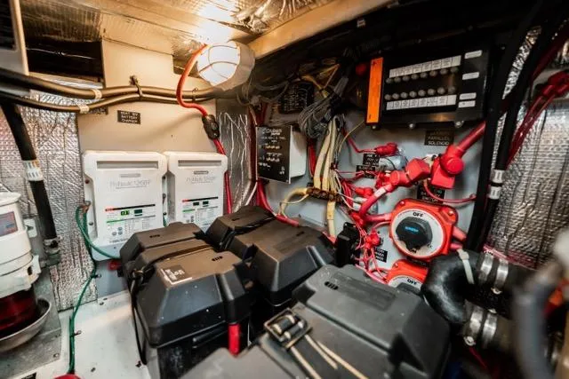 Slide: The Image of Engine room of 2005 Cruiser Yachts 405 EXPRESS with electrical components and wiring. - 96