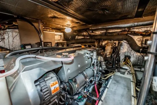 Slide: The Image of Engine room of 2005 Cruiser Yachts 405 EXPRESS, showcasing mechanical components and wiring. - 97