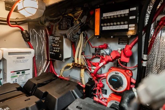 Slide: The Image of Electrical system of a 2005 Cruiser Yachts 405 EXPRESS, featuring wiring and control panels. - 98