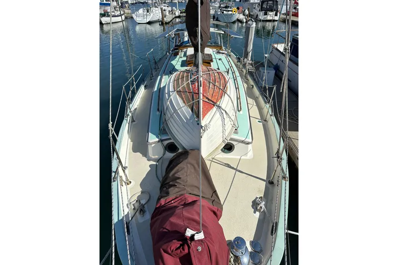 Slide: The Image of 1978 Tayana 37 sailboat docked in marina, view from deck. - 7
