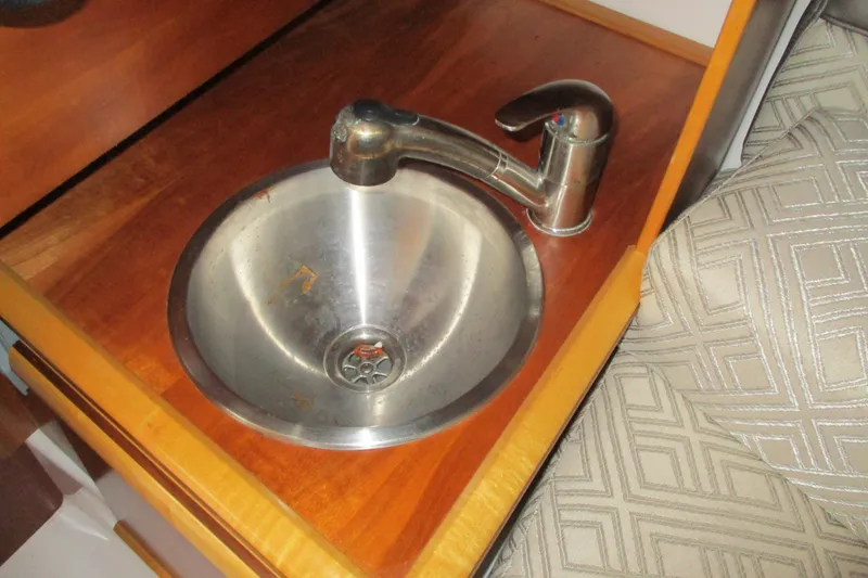 Slide: The Image of Stainless steel sink and faucet in 2018 Cutwater C-24 boat interior. - 34