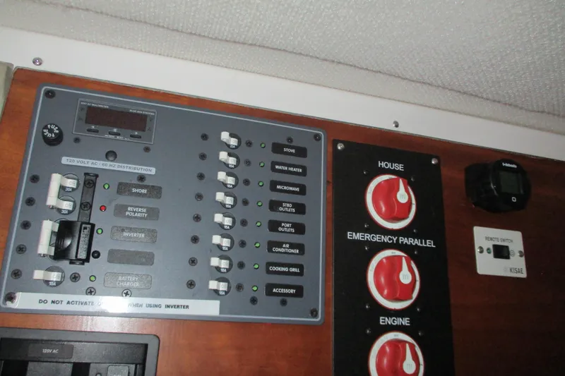 Slide: The Image of Electrical control panel on a 2018 Cutwater C-24 boat, featuring switches and gauges. - 36