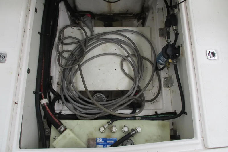 Slide: The Image of Engine compartment of a 2018 Cutwater C-24 boat, showing cables and components. - 41