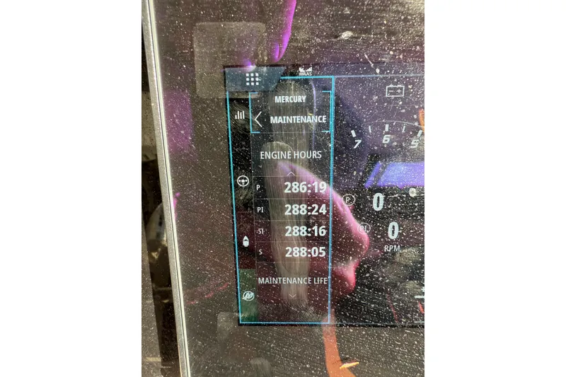 Slide: The Image of Display screen showing engine hours and maintenance for 2020 Boston Whaler 420 Outrage. - 18