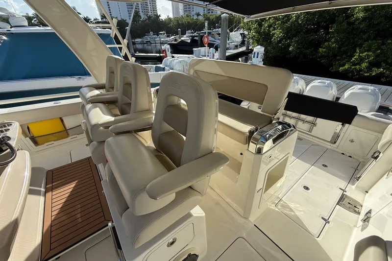 Slide: The Image of 2020 Boston Whaler 420 Outrage interior with luxurious seating and helm station. - 8