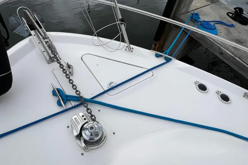 Slide: The Image of Bow of 2000 Sea Ray 400 Sedan Bridge with anchor chain and blue mooring lines. - 12