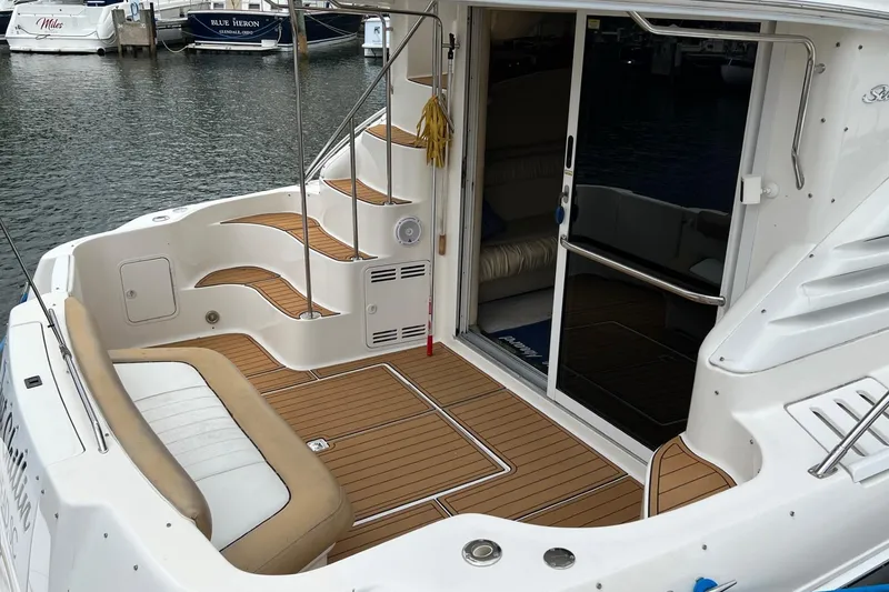 Slide: The Image of 2000 Sea Ray 400 Sedan Bridge yacht with teak deck and sliding glass door. - 13