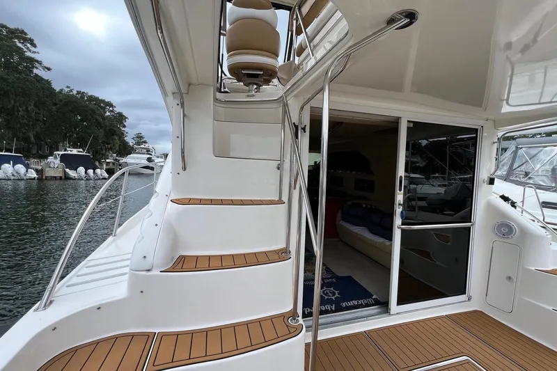 Slide: The Image of 2000 Sea Ray 400 Sedan Bridge yacht with teak steps and open cabin view. - 19