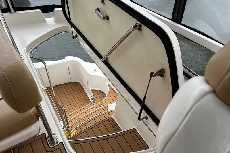Slide: The Image of 2000 Sea Ray 400 Sedan Bridge interior with teak steps and open hatch. - 20