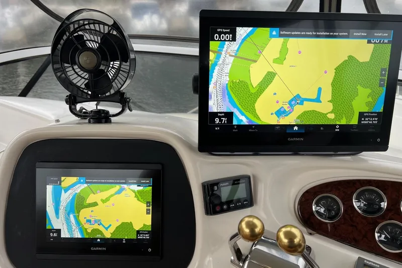 Slide: The Image of Dashboard of a 2000 Sea Ray 400 Sedan Bridge with Garmin navigation displays. - 26