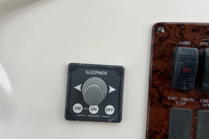 Slide: The Image of Control panel of a 2000 Sea Ray 400 Sedan Bridge with Sleipner thruster switch. - 32