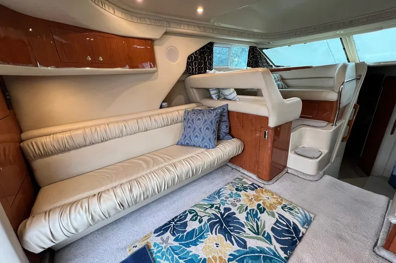 Slide: The Image of Luxurious interior of 2000 Sea Ray 400 Sedan Bridge with plush seating and elegant decor. - 38