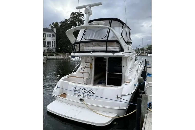 Slide: The Image of 2000 Sea Ray 400 Sedan Bridge yacht docked, rear view, "Just Chillin" in Hilton Head, SC. - 4