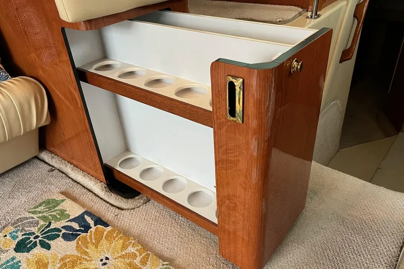 Slide: The Image of Cup holder cabinet on 2000 Sea Ray 400 Sedan Bridge yacht interior. - 44