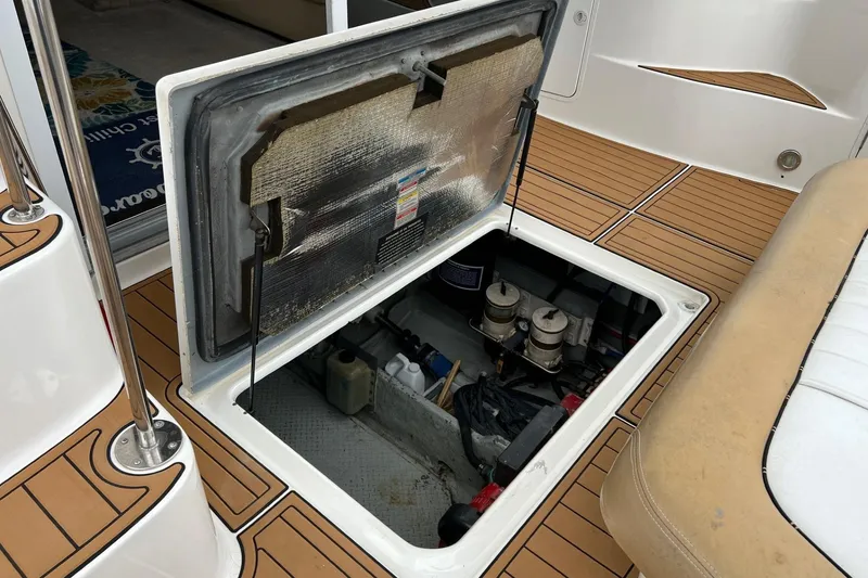 Slide: The Image of Open engine compartment of 2000 Sea Ray 400 Sedan Bridge yacht, showcasing interior components. - 60