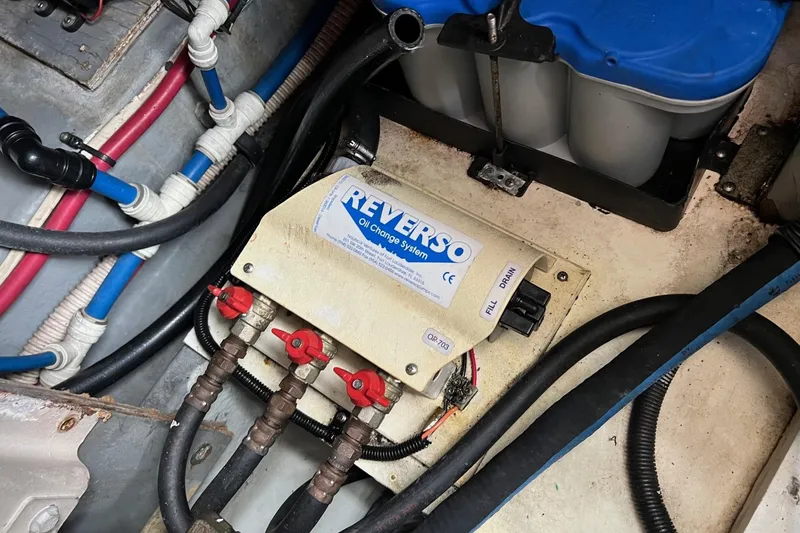 Slide: The Image of Engine compartment of 2000 Sea Ray 400 Sedan Bridge with Reverso oil change system. - 64