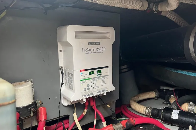 Slide: The Image of ProNautic 1250P charger in 2000 Sea Ray 400 Sedan Bridge engine room. - 65