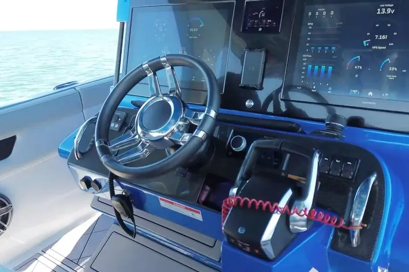 Slide: The Image of 2023 Mystic Powerboats M3800 dashboard with advanced controls and digital displays. - 25