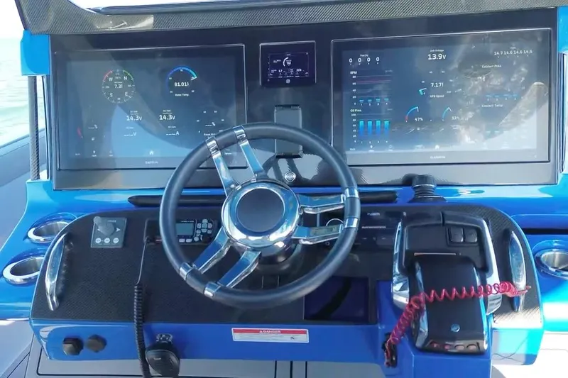 Slide: The Image of 2023 Mystic Powerboats M3800 dashboard with advanced navigation and control systems. - 26