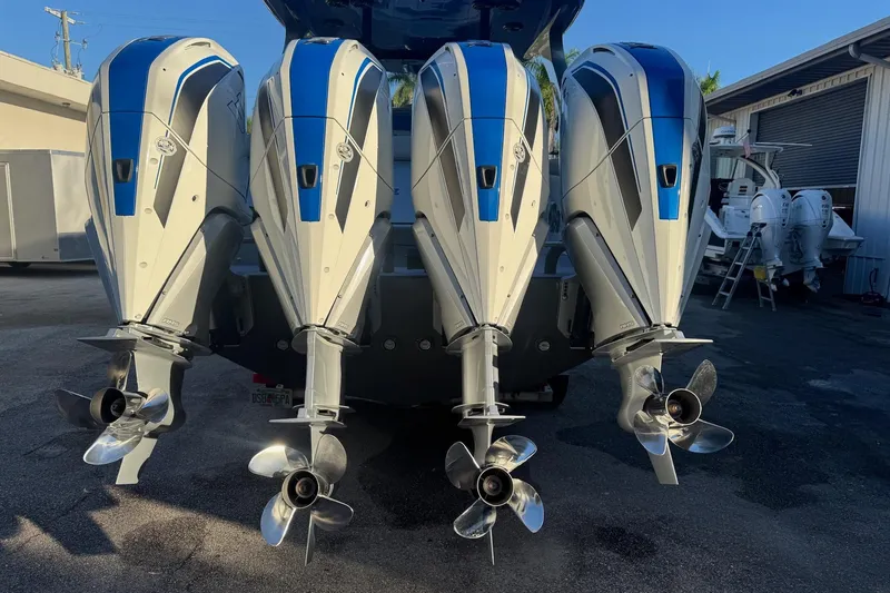 Slide: The Image of 2023 Mystic Powerboats M3800 with four powerful outboard engines. - 30