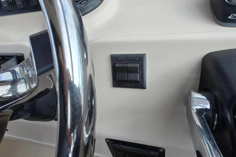 Slide: The Image of Close-up of 2005 Grady-White Marlin 300 boat controls and steering wheel. - 20