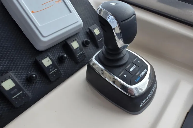 Slide: The Image of Joystick control panel on 2005 Grady-White Marlin 300 boat dashboard. - 21