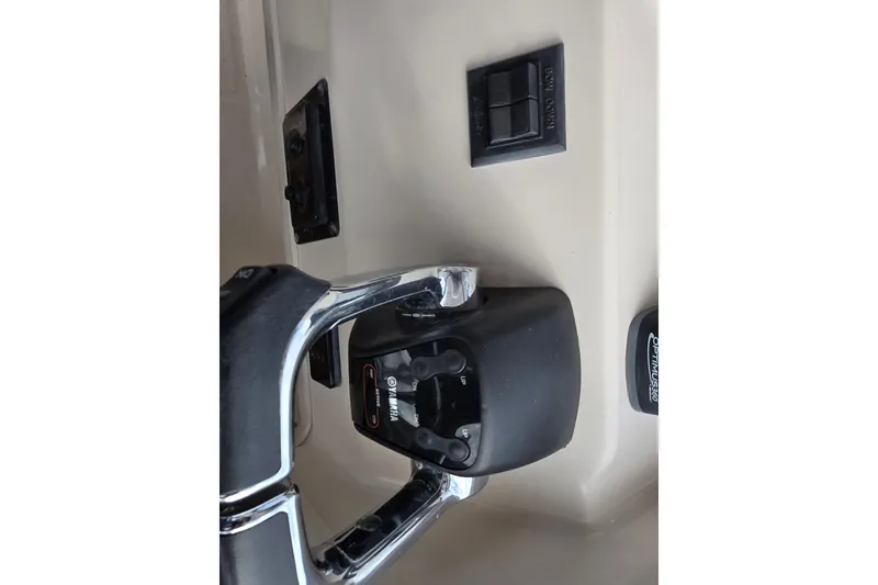 Slide: The Image of 2005 Grady-White Marlin 300 boat controls with Yamaha throttle and switches. - 22