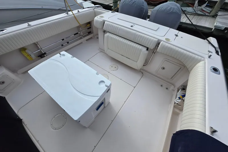 Slide: The Image of 2005 Grady-White Marlin 300 boat deck with seating and storage compartments. - 3