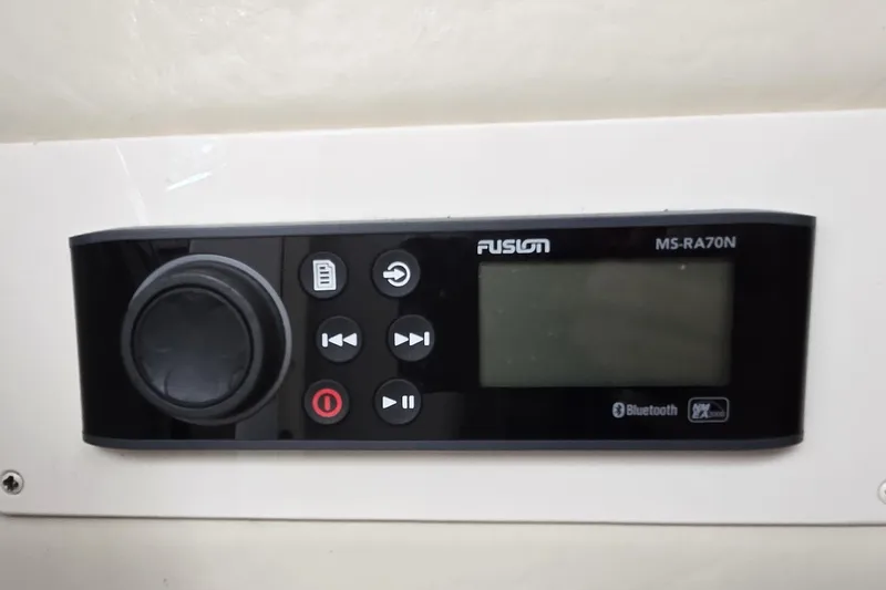 Slide: The Image of Fusion MS-RA70N stereo system on 2005 Grady-White Marlin 300 boat, featuring Bluetooth connectivity. - 31