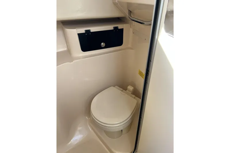 Slide: The Image of 2005 Grady-White Marlin 300 boat bathroom interior with compact toilet. - 41