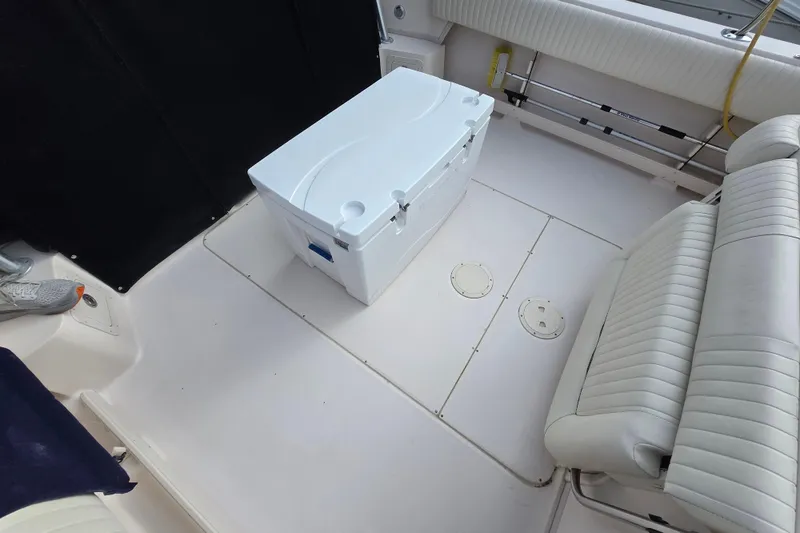 Slide: The Image of 2005 Grady-White Marlin 300 boat interior with seating and cooler. - 6