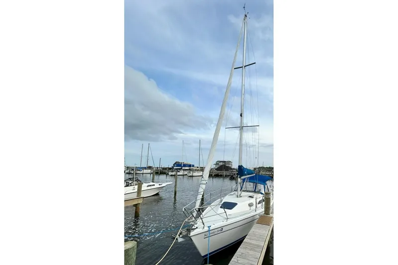 Slide: The Image of Sailboat cockpit view of 1999 Catalina 28 MkII with blue canopy and steering wheel. - 16