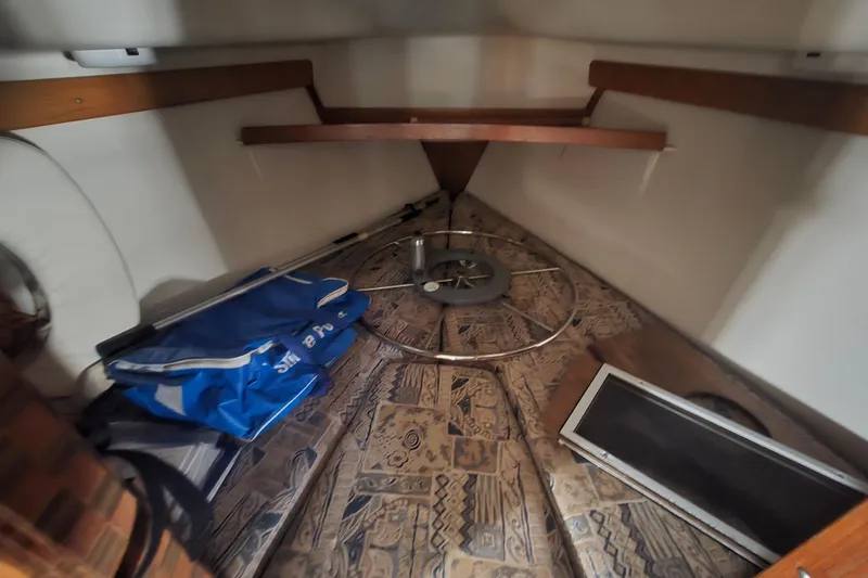 Slide: The Image of Interior cabin of a 1999 Catalina 28 MkII sailboat with storage items. - 27
