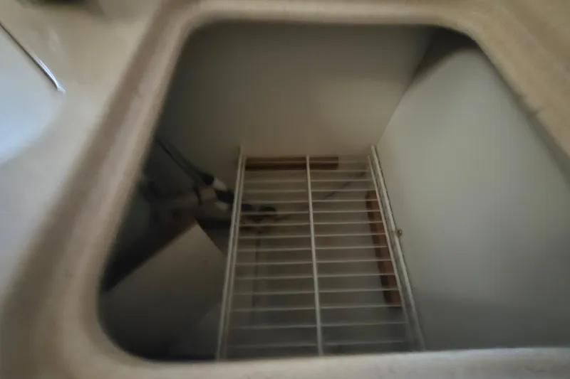 Slide: The Image of Interior view of a 1999 Catalina 28 MkII sailboat's storage compartment. - 36