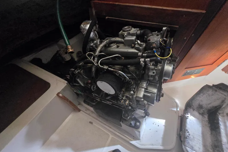Slide: The Image of Engine compartment of a 1999 Catalina 28 MkII sailboat, showcasing detailed mechanical components. - 39