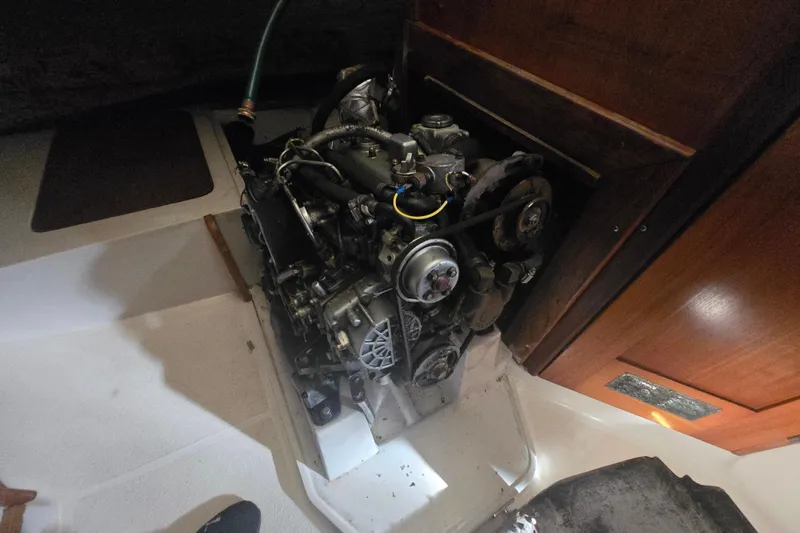 Slide: The Image of Engine compartment of a 1999 Catalina 28 MkII sailboat, showcasing mechanical components. - 41