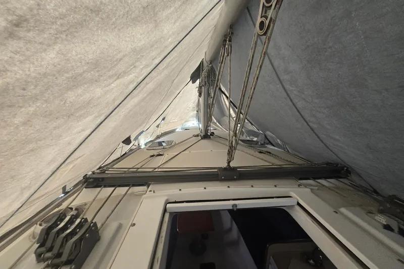 Slide: The Image of Interior view of a 1999 Catalina 28 MkII sailboat under a protective cover. - 43