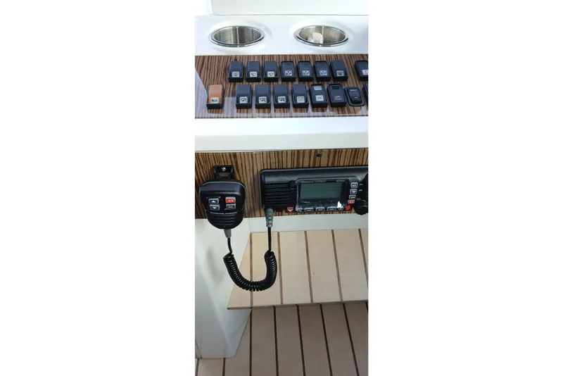 Slide: The Image of Control panel of 2014 Cruisers Yachts 41 Cantius with radio and switches. - 11