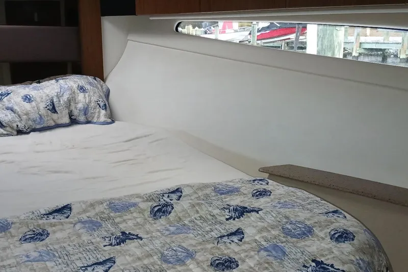 Slide: The Image of Interior cabin of 2014 Cruisers Yachts 41 Cantius with nautical-themed bedding. - 21