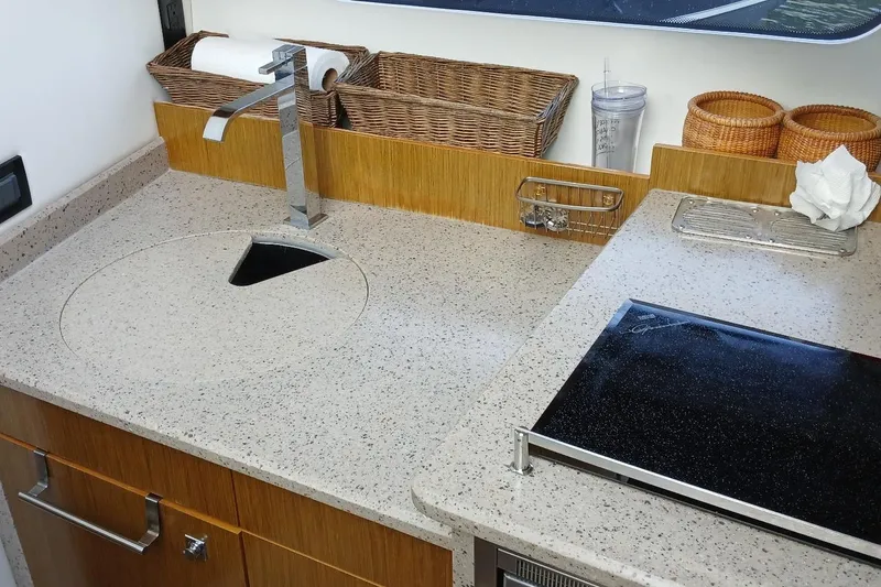 Slide: The Image of Modern kitchen area in 2014 Cruisers Yachts 41 Cantius with sleek countertop and sink. - 25