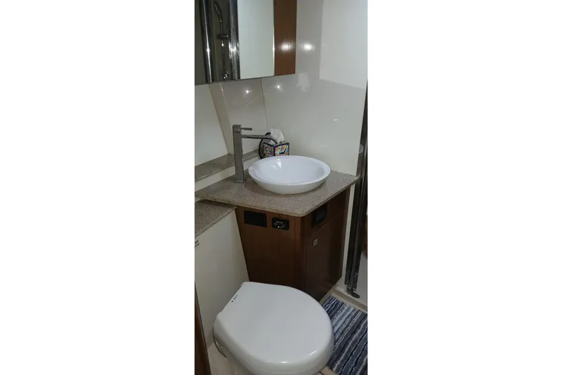 Slide: The Image of Bathroom interior of 2014 Cruisers Yachts 41 Cantius with modern sink and toilet. - 26
