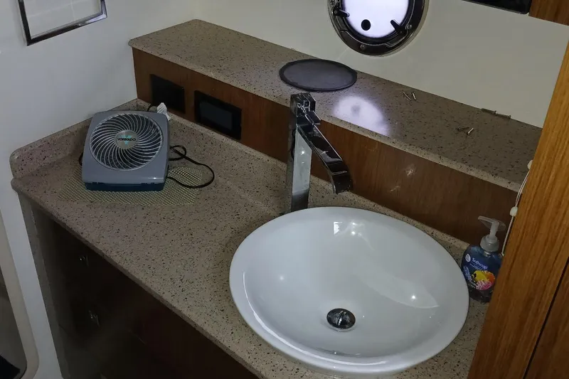 Slide: The Image of Bathroom sink area in 2014 Cruisers Yachts 41 Cantius with fan and soap dispenser. - 29