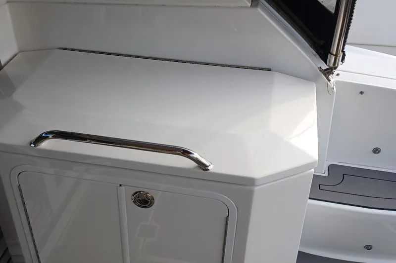 Slide: The Image of 2014 Cruisers Yachts 41 Cantius interior detail with sleek white cabinetry and chrome handle. - 6