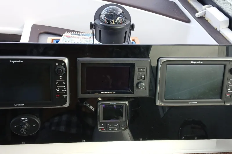 Slide: The Image of Control panel of 2014 Cruisers Yachts 41 Cantius with Raymarine and Volvo Penta displays. - 9