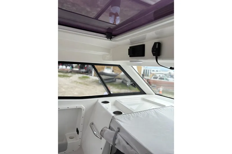 Slide: The Image of Interior of 2020 Protector 310 Targa boat, featuring sleek design and modern amenities. - 13