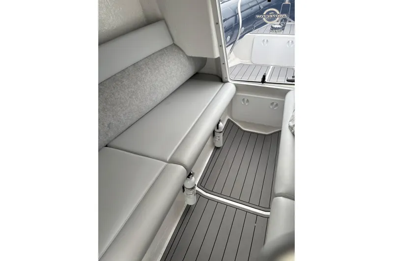 Slide: The Image of Interior of 2020 Protector 310 Targa boat with gray seating and flooring. - 17