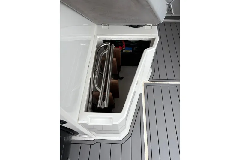 Slide: The Image of Storage compartment on 2020 Protector 310 Targa boat with folded ladder and equipment. - 22