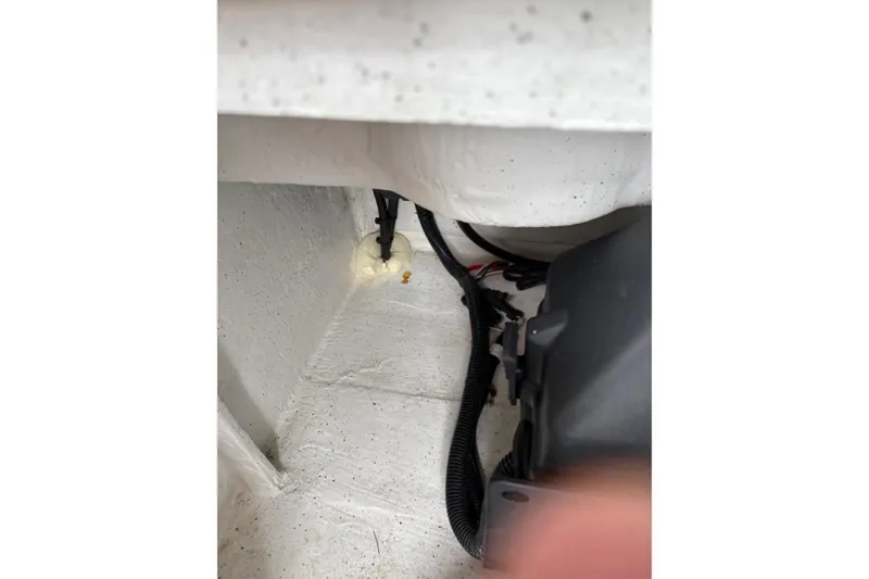 Slide: The Image of Interior view of a 2020 Protector 310 Targa boat, showing wiring and components. - 23