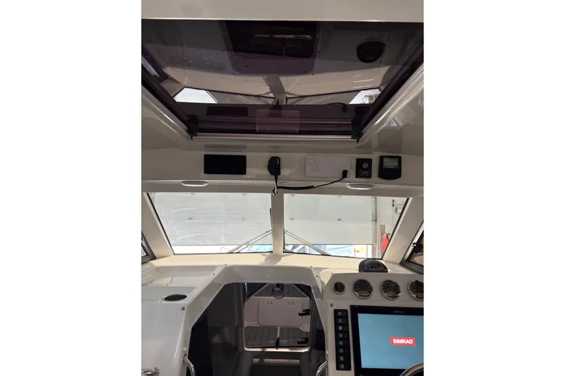 Slide: The Image of Interior view of 2020 Protector 310 Targa boat cockpit with navigation equipment. - 27
